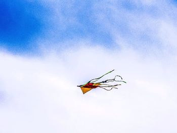 Low angle view of airplane flying in sky