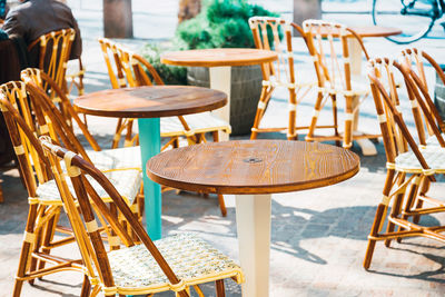 Empty chairs and tables at cafe