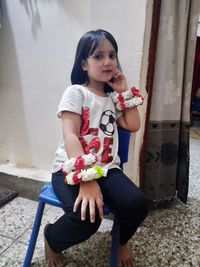 Full length of a girl holding flower