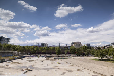 View of buildings against cloudy sky