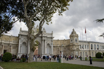 Group of people in front of historical building