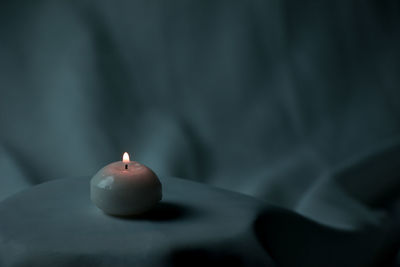Close-up of illuminated candle