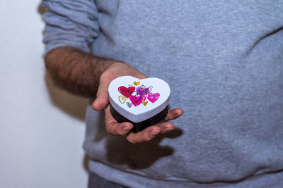 Close-up of man holding cup