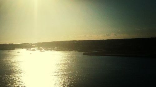 Scenic view of lake at sunset