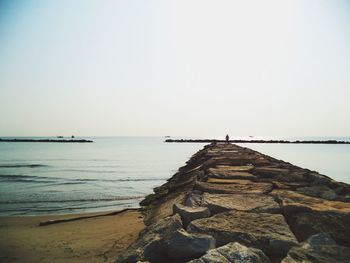 Pier on sea against sky