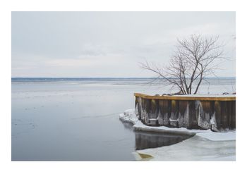 Scenic view of sea against sky during winter