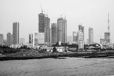 Modern buildings in city against sky