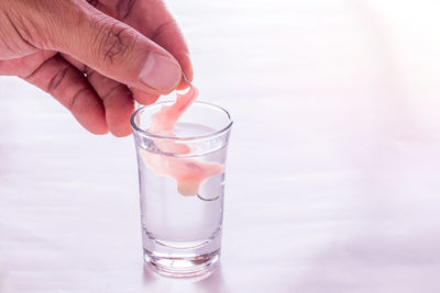 Close-up of hand holding drink