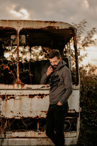 Full length of man standing in abandoned bus