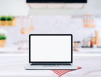 Close-up of laptop on table