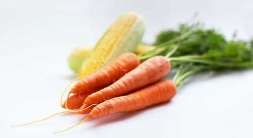 Close-up of carrots against white background
