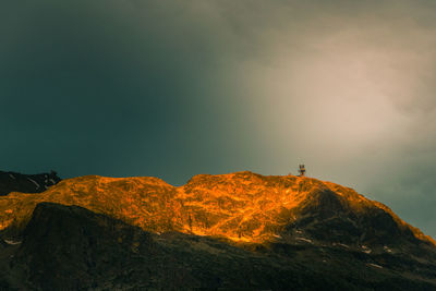 Scenic view of rock against sky. scenic view of top of mountain. 