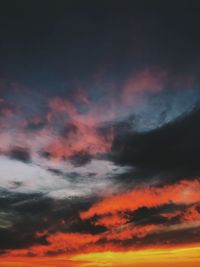 Low angle view of dramatic sky during sunset