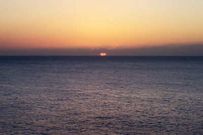 Scenic view of sea against clear sky during sunset