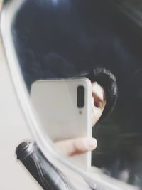 Close-up of man using mobile phone