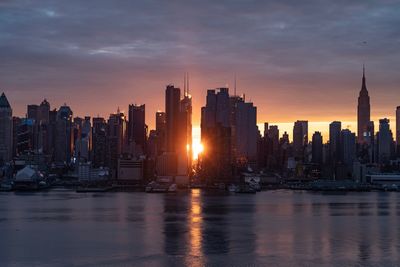 Panoramic view of buildings against sky during sunset