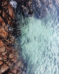 Close-up of sea waves against rocks