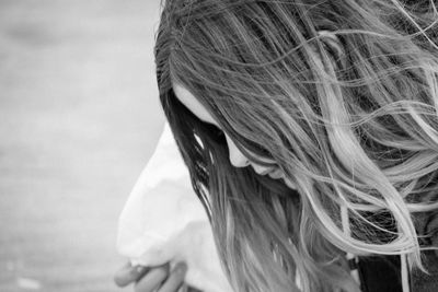 Side view of woman with tousled hair