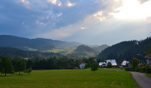 Scenic view of mountains against cloudy sky