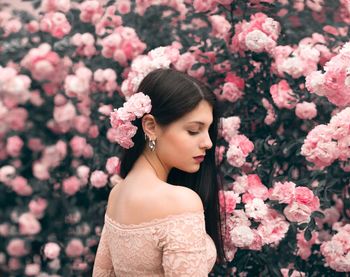 Portrait of woman with pink flowers