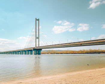 Bridge over sea against sky