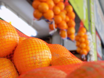 Close-up of orange fruits for sale at market stall