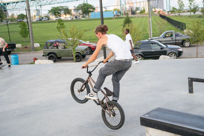 People riding bicycle on road