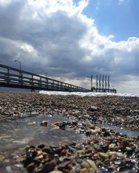 Bridge over sea against sky