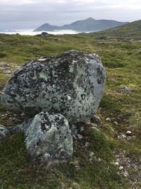 View of rocks on land against sky