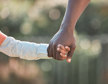 Cropped hand of man holding hands