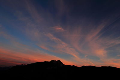 Silhouette mountains against sky during sunset