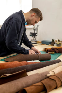 Side view of man working at home