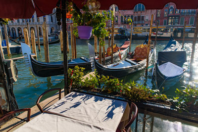 Boats moored in canal