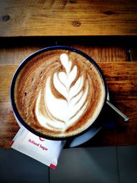 High angle view of cappuccino on table