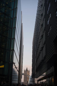 Low angle view of city at sunset