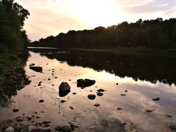 Scenic view of lake against sky during sunset