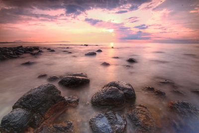 Scenic view of sea against sky during sunset