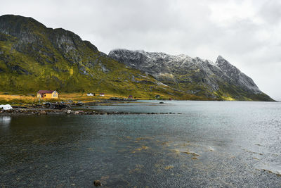 Scenic panorama view of  cabins at the coast on lofoten islands in norway during winter