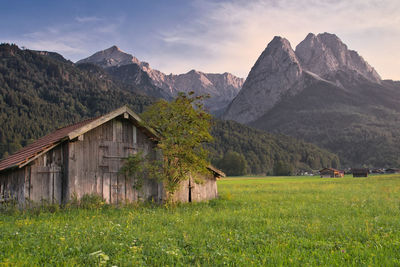 Scenic view of landscape and mountains against sky