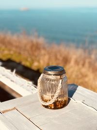 Close-up of food on table against sea