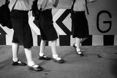 Woman walking on road