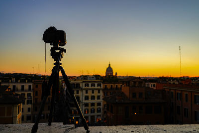 Buildings against sky during sunset