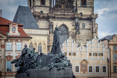 Statues and church in city