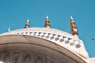 Low angle view of building against blue sky