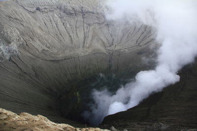 Smoke emitting from volcanic mountain