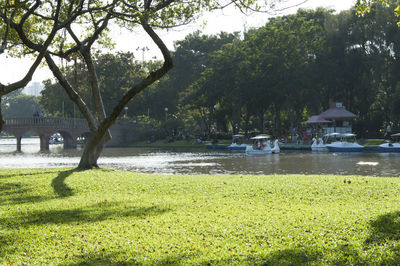 Boats moored in river