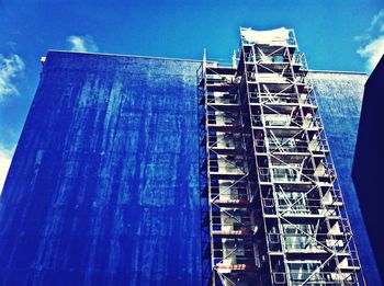 Low angle view of built structure against blue sky