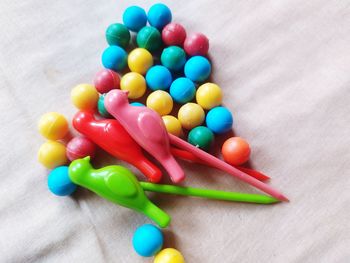 High angle view of multi colored candies on table