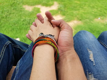 Midsection of woman holding hands