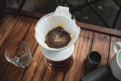 Barista dripping coffee and slow coffee bar style